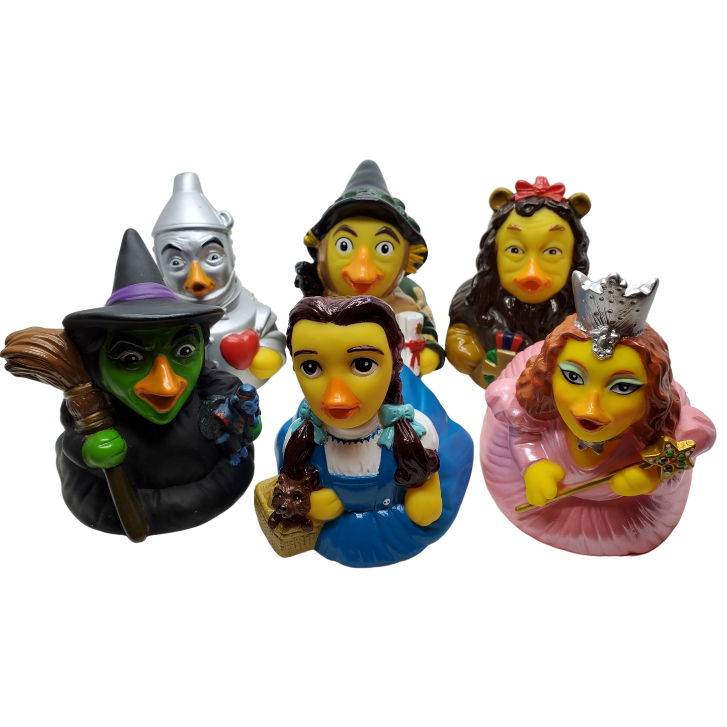 Set of colorful figurines resembling characters from a fairy tale on a white background