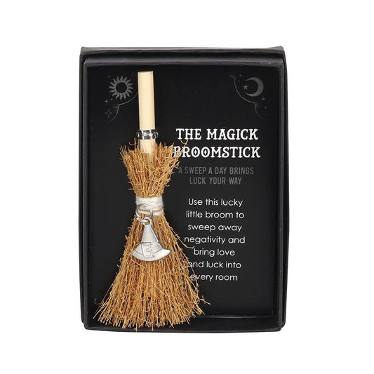 Magick broomstick in a black box with text on a white background