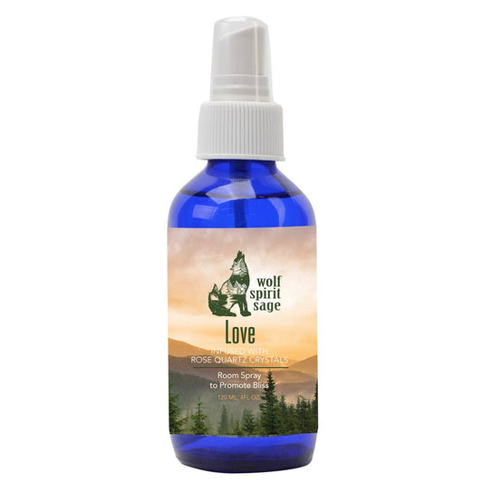 Blue spray bottle with a label featuring a wolf and nature imagery on a white background