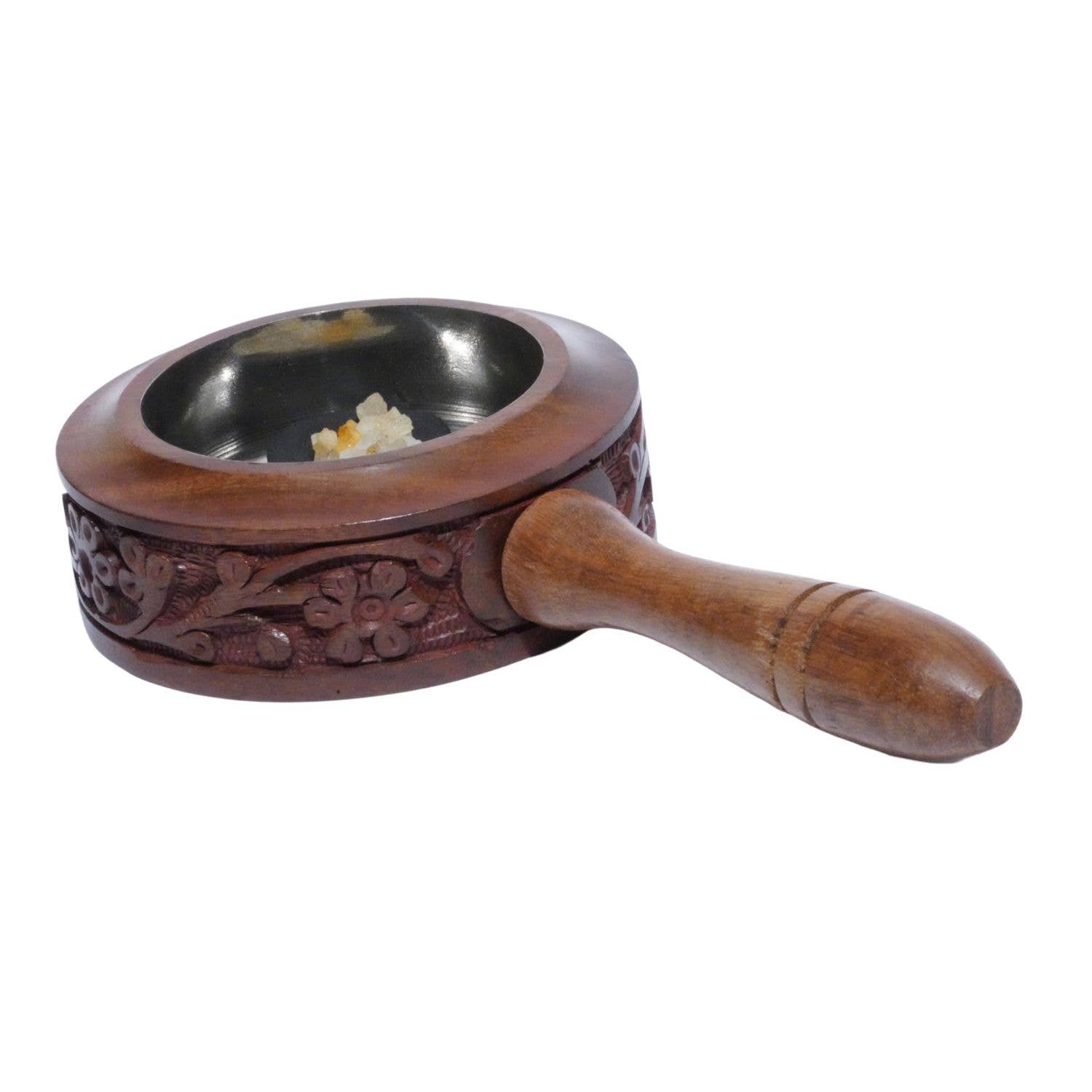 Wooden-handled metal bowl with floral carvings on a white background