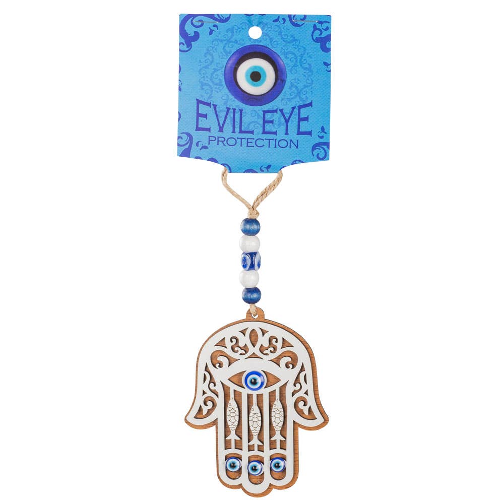 Decorative evil eye charm with Hamsa design on a white background