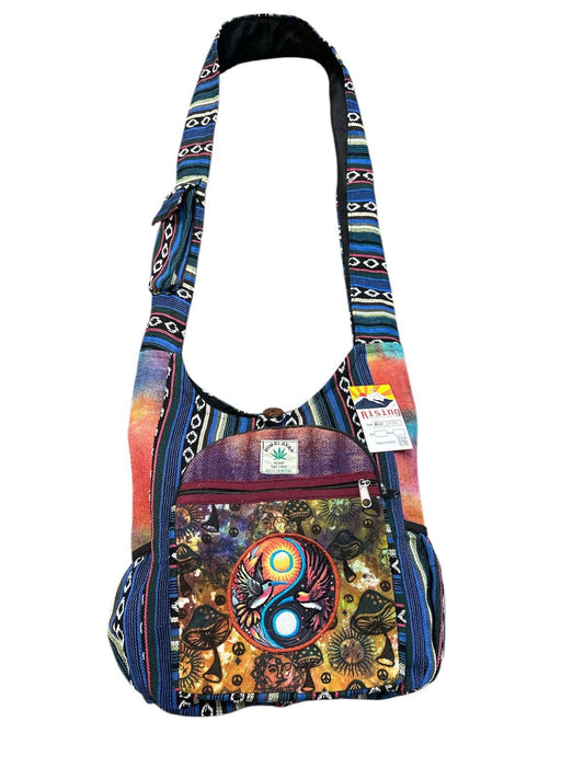 Colorful shoulder bag with a yin yang design on a white background