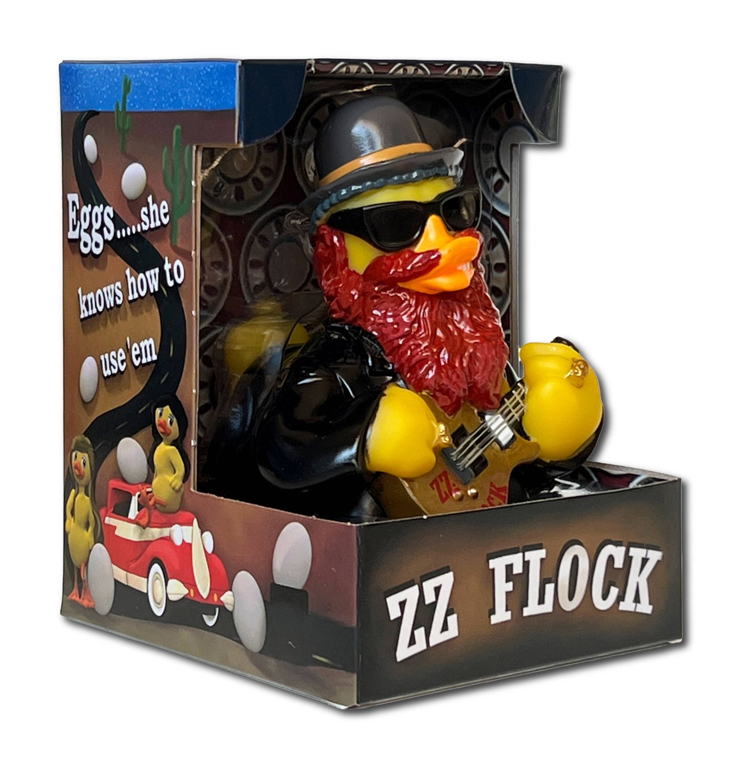 Toy duck in a leather outfit with sunglasses and guitar, in a decorative box with text and graphics.