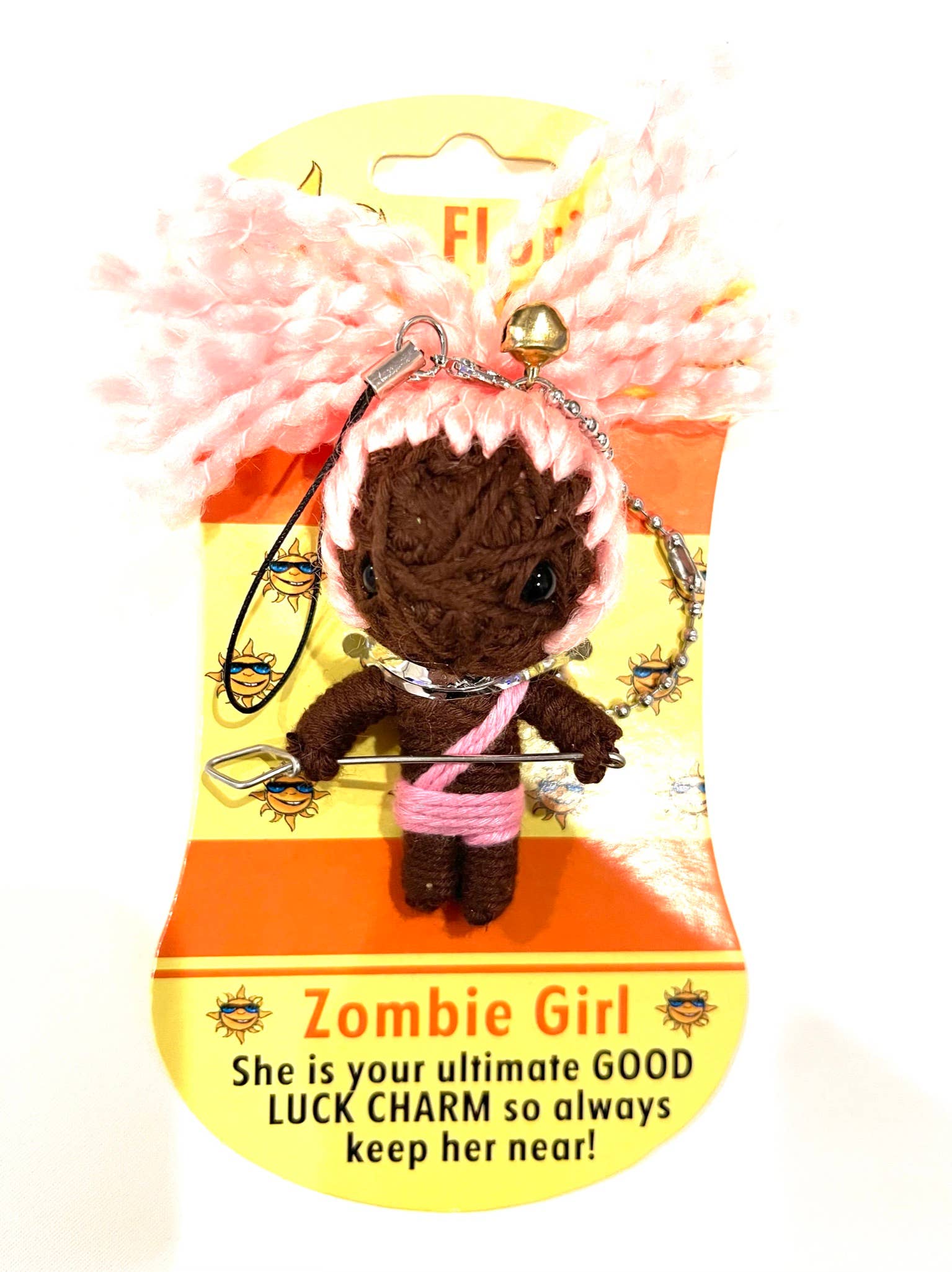 Zombie girl charm with pink bow on a yellow and orange packaging