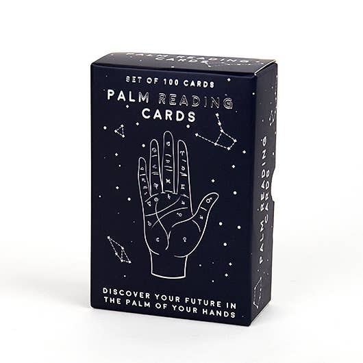 Box of palm reading cards with astrological symbols on a white background