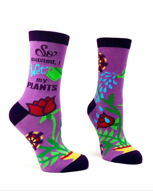 Purple socks with floral design and text on a white background